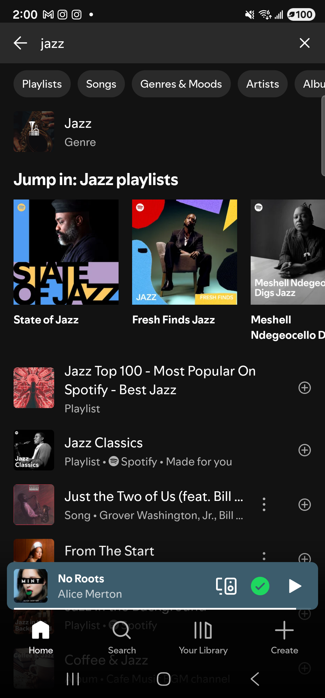 The Spotify Android app foregrounded on the same Samsung Galaxy S23 Ultra in dark mode. At the top, a back arrow, a dark search field showing the query ‘jazz’, and an ✕ clear button. Below the search bar a horizontal row of filter chips: Playlists, Songs, Genres & Moods, Artists, Albums. Below the chips is a top-hit row labeled ‘Jazz · Genre’ with a small cover. A heading reads ‘Jump in: Jazz playlists’ above three large cover tiles in a horizontal row: ‘State of Jazz’ (red overlay), ‘Fresh Finds Jazz’, and ‘Meshell Ndegeocello Digs Jazz’. Below that, a vertical list of more results: ‘Jazz Top 100 - Most Popular On Spotify - Best Jazz · Playlist’, ‘Jazz Classics · Playlist · Spotify · Made for you’, ‘Just the Two of Us (feat. Bill …) · Song · Grover Washington Jr., Bill …’, and ‘From The Start’. A persistent now-playing bar near the bottom shows ‘No Roots — Alice Merton’ with cast / connected and play controls. The bottom navigation bar shows Spotify’s standard tabs Home, Search, Your Library, Create.
