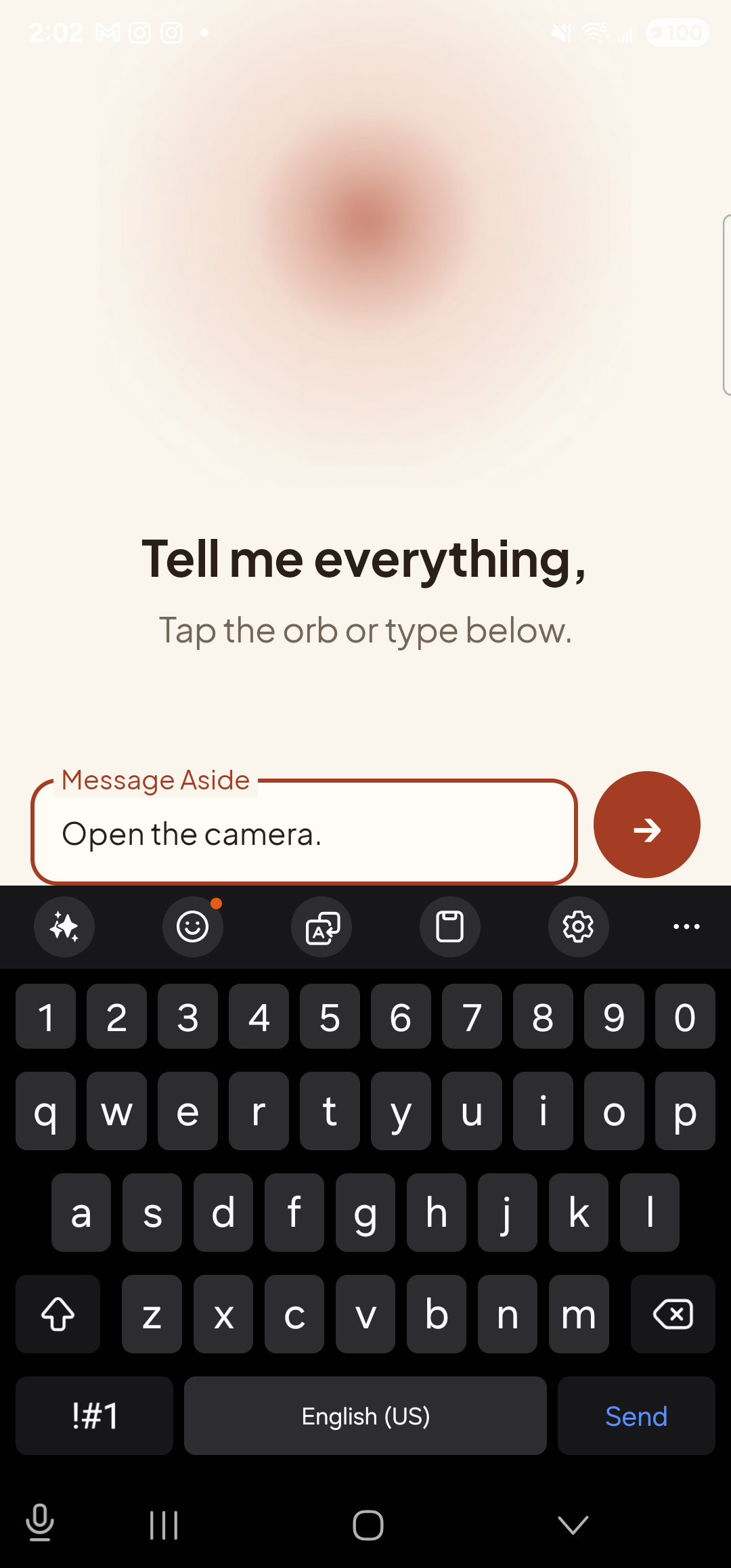 The Aside main screen with text-input mode active. The bottom of the screen now shows an outlined text field labeled ‘Message Aside’ with the typed sentence ‘Open the camera.’ inside it. To the right of the text field is a clay-red circular Send button with a paper-plane glyph. The orb is still visible in the upper portion of the screen, in its idle state.