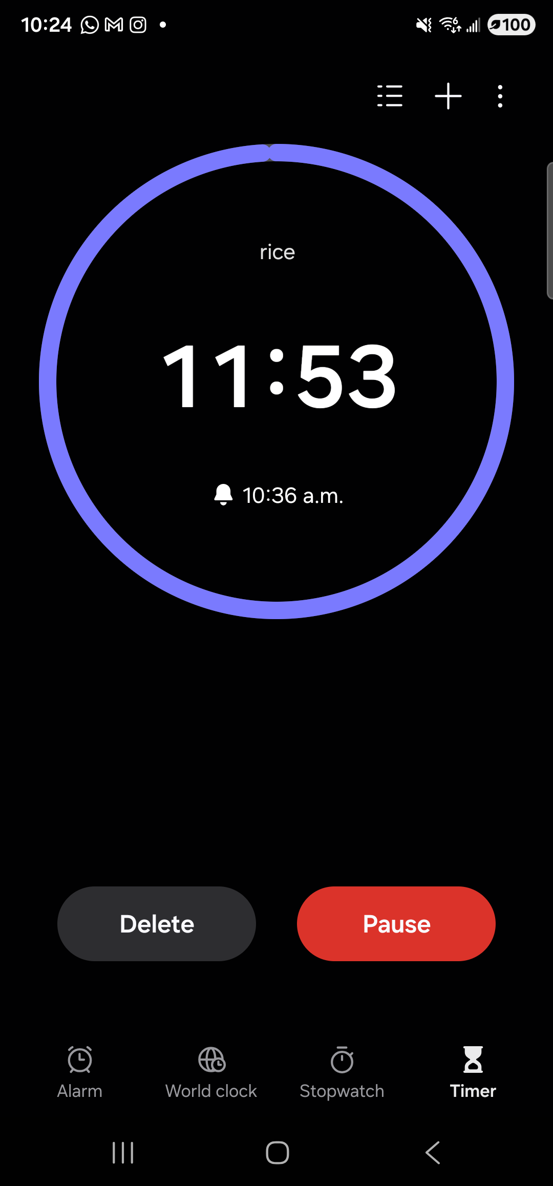 The Samsung Clock app on the Galaxy S23 Ultra, in dark mode on the Timer tab. A near-complete purple-violet ring fills most of the upper half of the screen, indicating the timer is most of the way around. Inside the ring: the small label ‘rice’ at the top, the large white remaining-time digits ‘11:53’ in the center, and below them a small bell icon next to the alarm time ‘10:36 a.m.’. Top-right of the screen are a list icon, a ‘+’ add-timer button, and a three-dot overflow menu. Below the ring, near the bottom of the screen, two pill buttons: a dark gray ‘Delete’ button on the left and a red ‘Pause’ button on the right. The bottom tab bar shows Alarm, World clock, Stopwatch, and Timer with Timer highlighted.