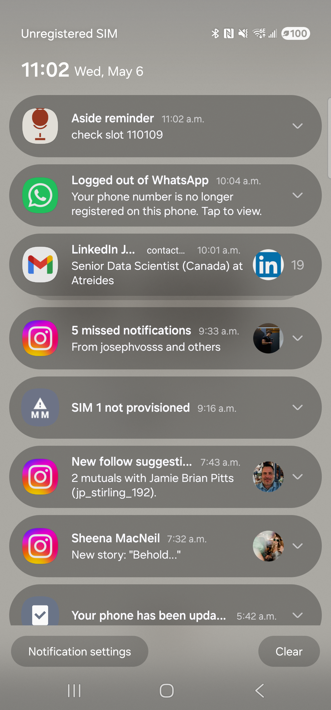 The Samsung notification shade pulled down on the Galaxy S23 Ultra. At the top: the date-time line ‘11:00 Wed, May 6’. The first card in the list is the freshly fired Aside reminder — a small warm-paper Aside icon with a clay dot at the left, the title ‘Aside reminder’ in bold above the body line ‘check slot 110109’, and the timestamp ‘11:02 a.m.’ at the right. Below the Aside reminder are unrelated pre-existing notifications (a logged-out WhatsApp banner, a LinkedIn job alert, a missed-Instagram count, a SIM-not-provisioned card, and so on).
