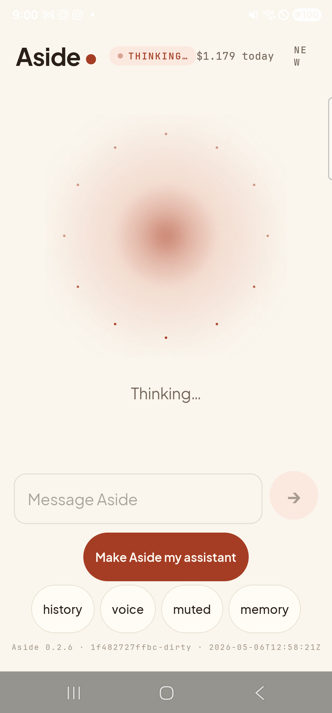 The Aside main screen in the thinking state, captured during a typed turn. The status pill at the top reads ‘● THINKING…’. The orb has a deeper core with eight small dots radiating outward in a steady ring — the visual indicator that work is in flight. The caption beneath the orb reads ‘Thinking…’. The ‘Message Aside’ text input is visible (now empty) with a faint send-arrow button to its right. Below that the bottom pill row reads ‘history / voice / muted / memory’ — the ‘type’ pill has become ‘voice’ now that text-input mode is active.