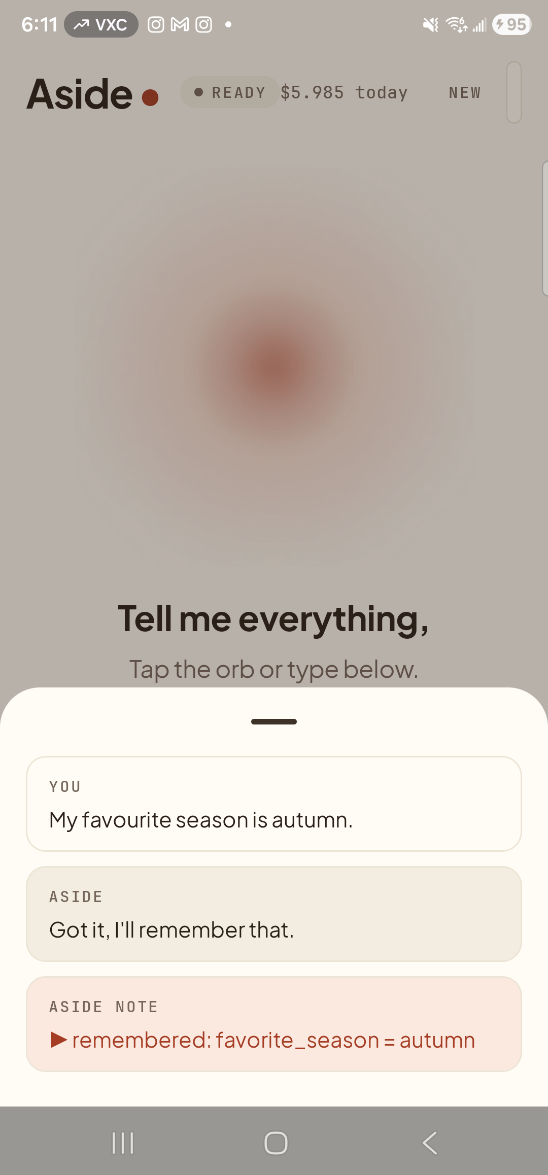 The Aside main screen with the chat history bottom sheet showing the recent exchange. Status pill at the top reads ‘● READY’ alongside the cost counter ‘$5.985 today’. Inside the sheet: a label ‘YOU’ above the line ‘My favorite season is autumn.’; below it a label ‘ASIDE’ above the reply ‘Got it, I’ll remember that.’; below that an ‘ASIDE NOTE’ chip with a small play arrow and the line ‘remembered: favorite_season = autumn’.